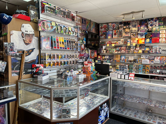 In side our store image with a focus on glass cases holding valuable trading cards