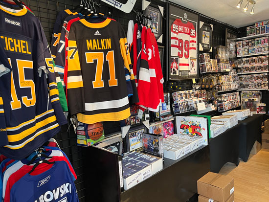 In side our store image with a focus on a Malkin jersey.